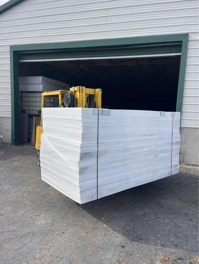 Forklift moving a bundle of EPS foam out of the shop
