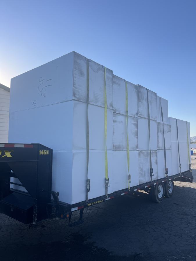 Trailer loaded with strapped white EPS foam